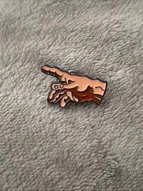 Enamel pin of The Creation of Adam hand